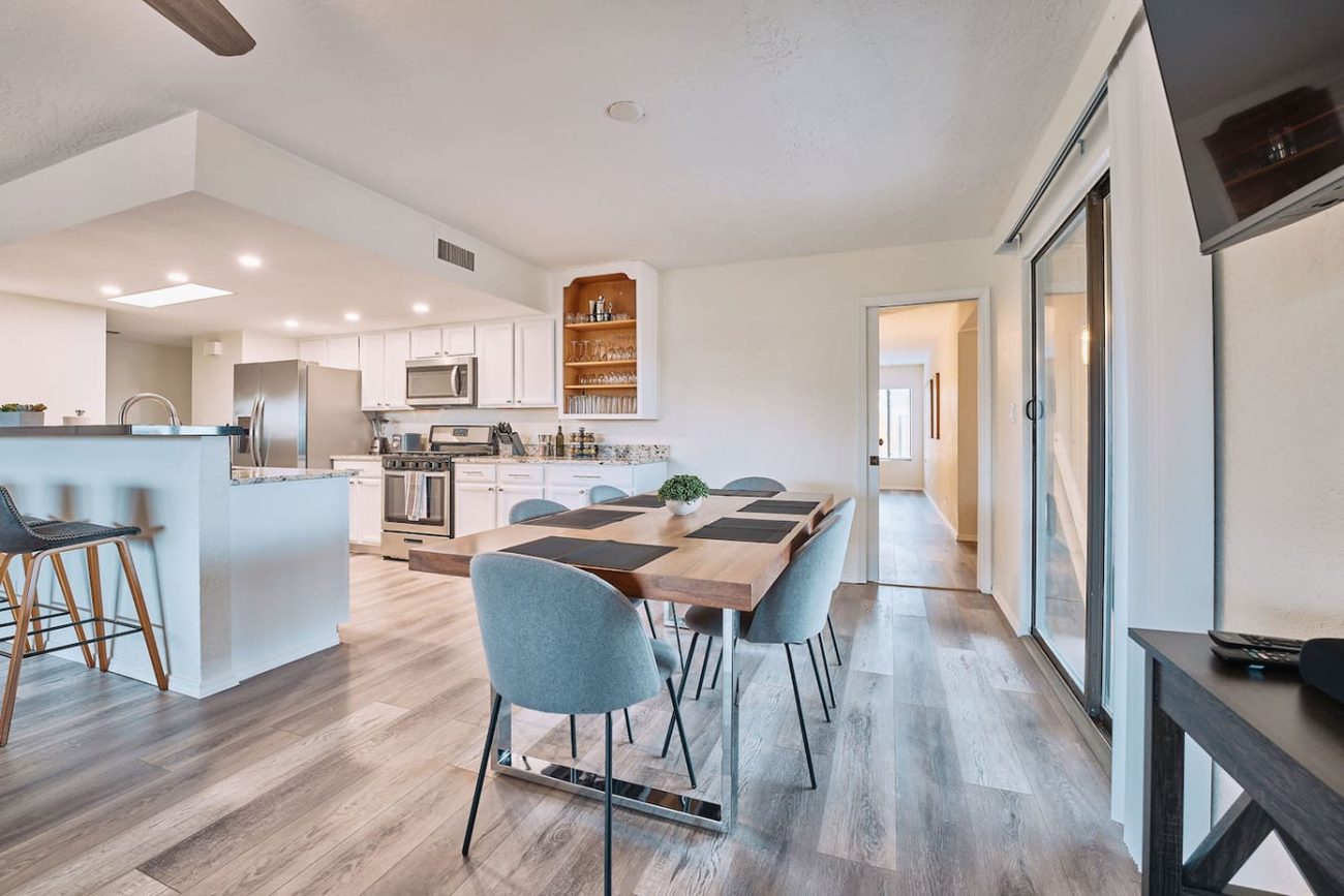 Bright open-plan kitchen and dining area with seating for the whole group