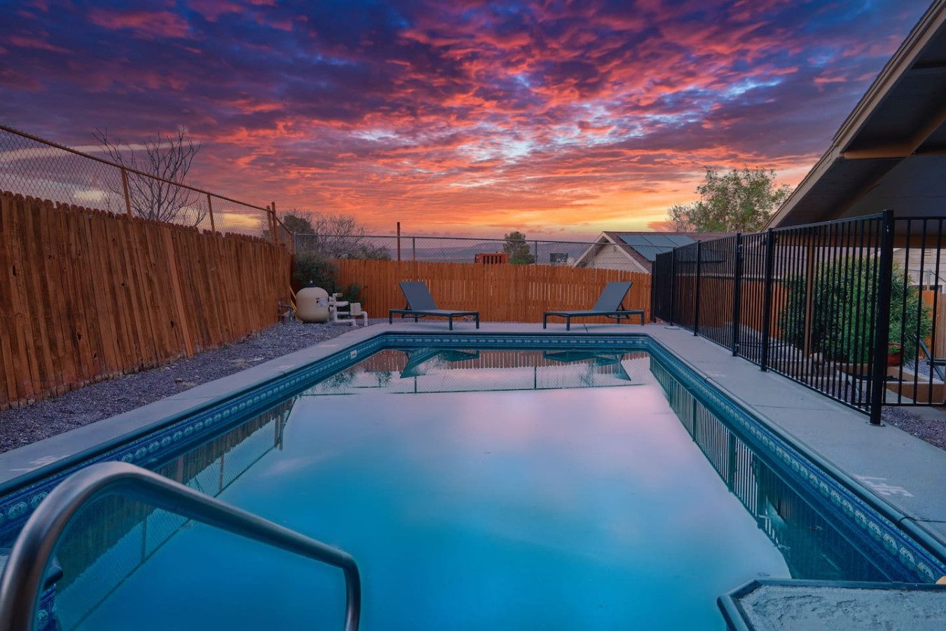 Private pool glowing at sunset at the Cottonwood Castaway vacation rental in Cottonwood, Arizona